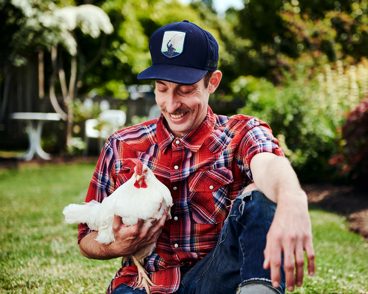 lifestyle photographer Amos Morgan captures a man with his chicken