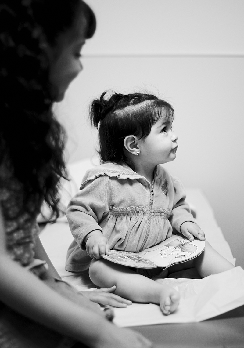 Healthcare photographer documents little girl waiting for the doctor to arrive