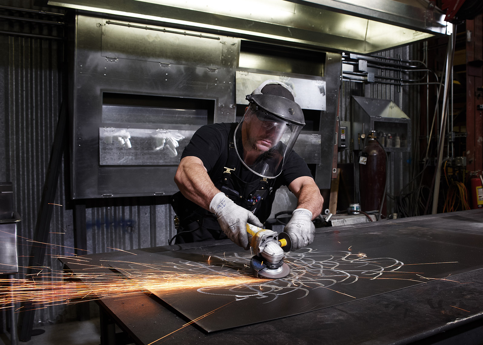 sheet metal worker photographed in action