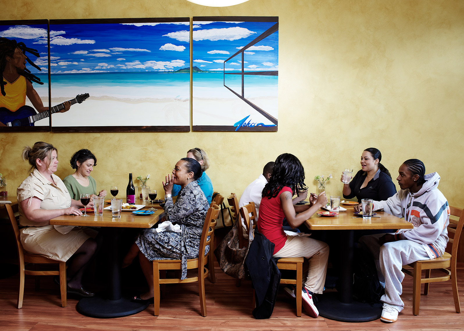 Diner enjoy a meal at Island Soul as captured by  Seattle Magazine photographer Amos Morgan 