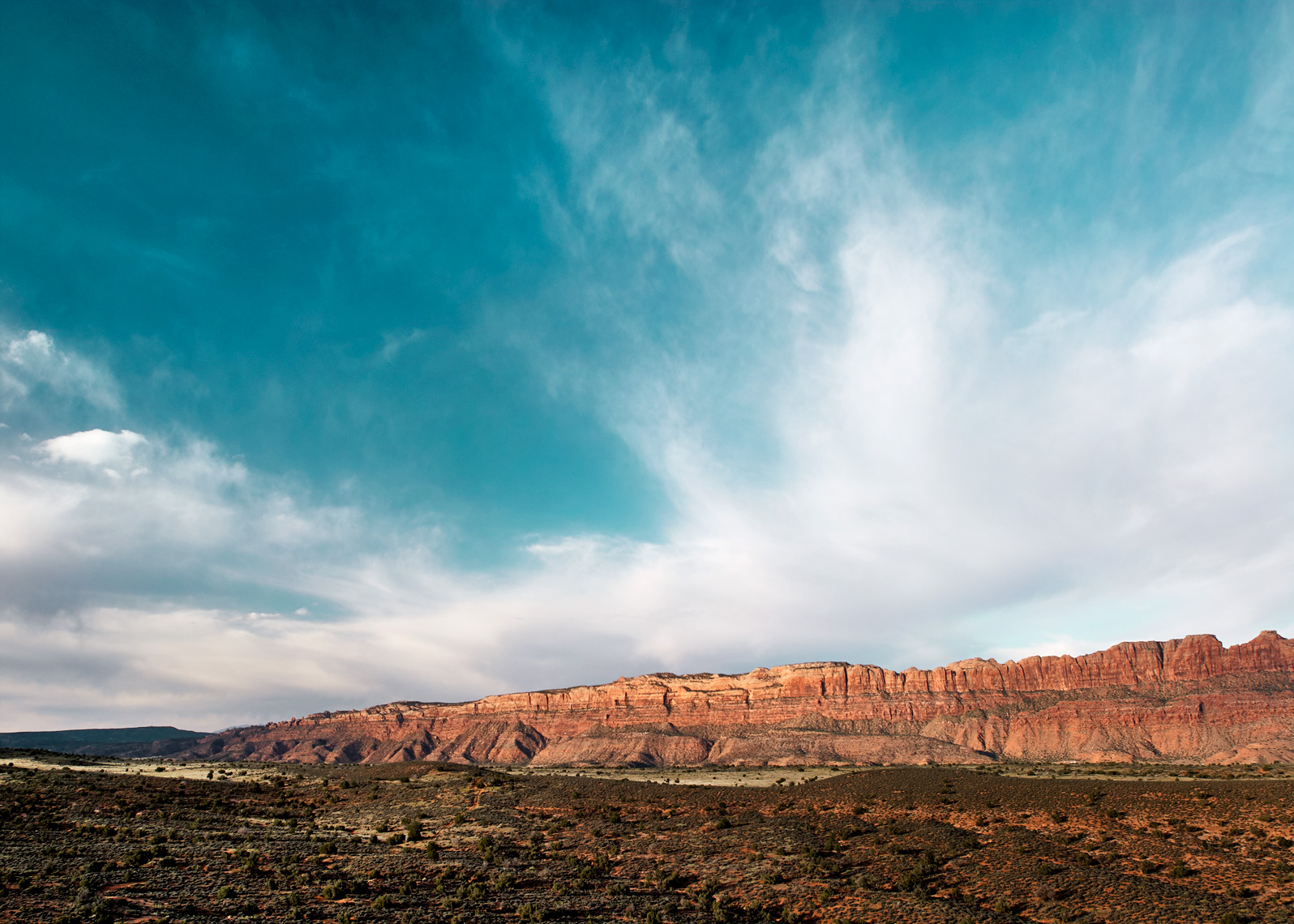 Moab rocks and cloud formations in this large-scale landscape