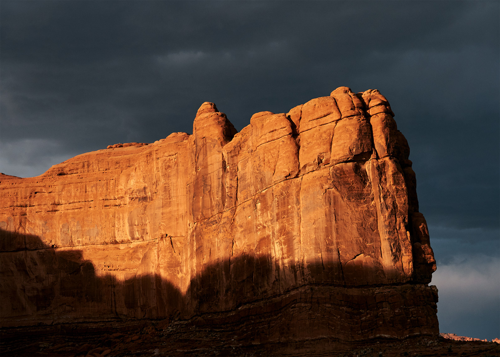 Moab rock formation storm looms dramatic landscape
