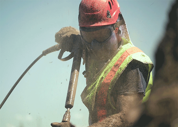 Man drilling in preperation for building