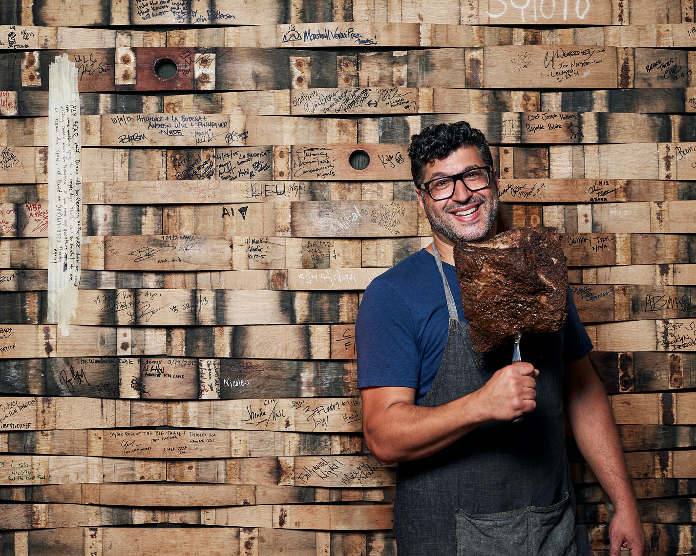 Man poses with pastrami for magazine portrait