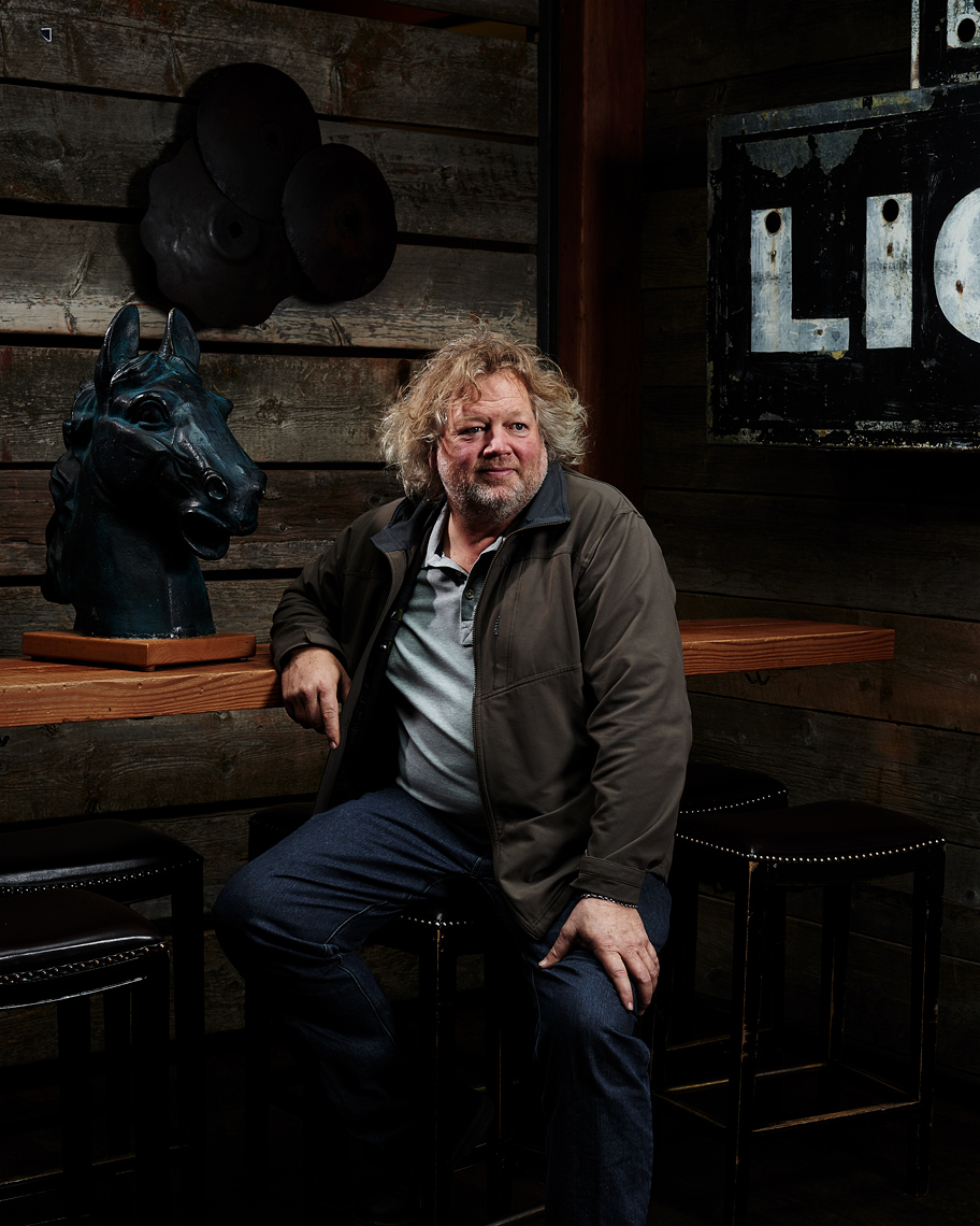 Restauranteur Tom Douglas sits for his portrait in his Seattle restaurant